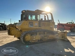 Side of used Dozer under sun